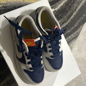 Nike Navy and White Sneakers with Orange Accent
